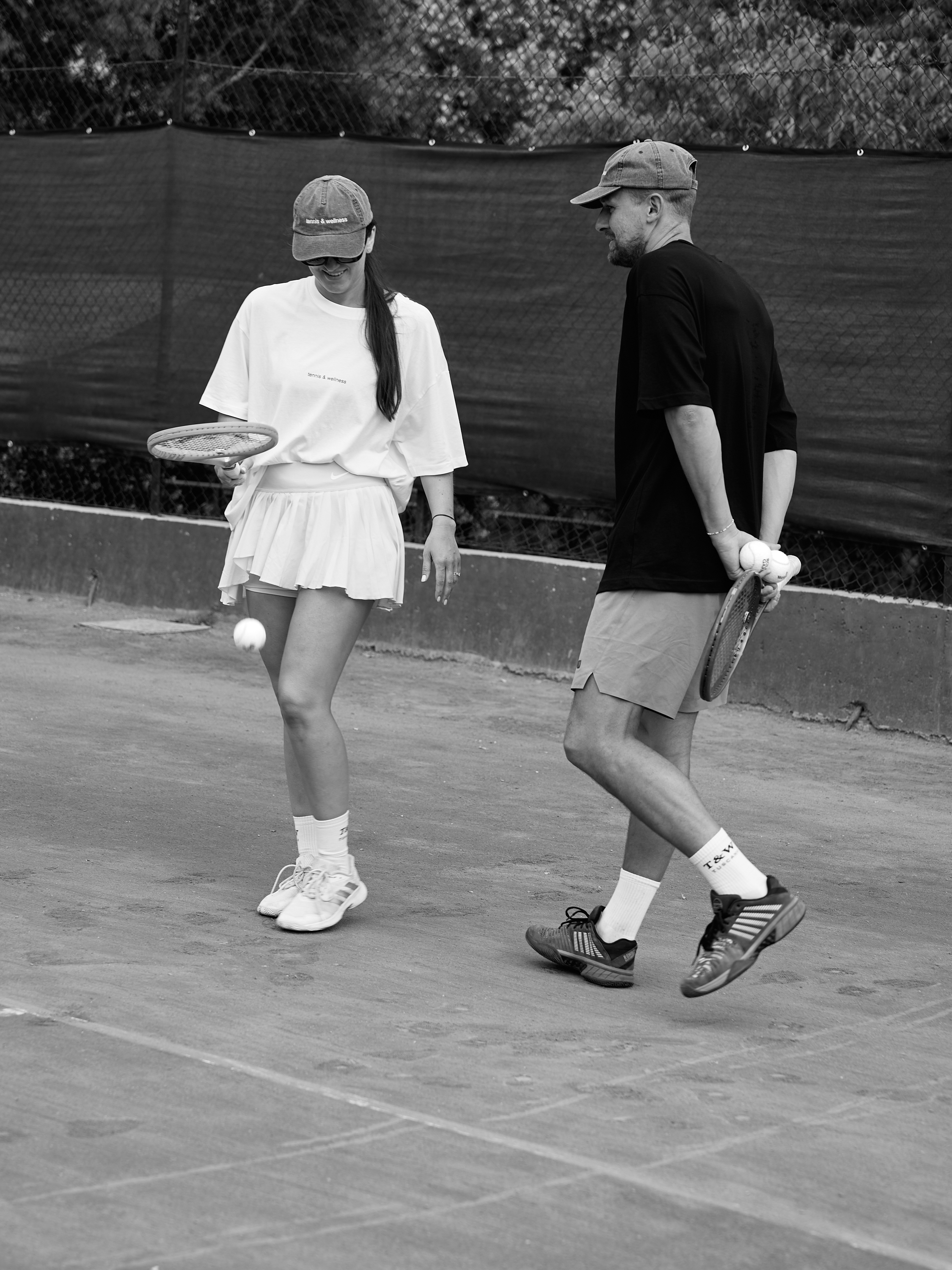 Two members walking off court together at the Vilnius club
