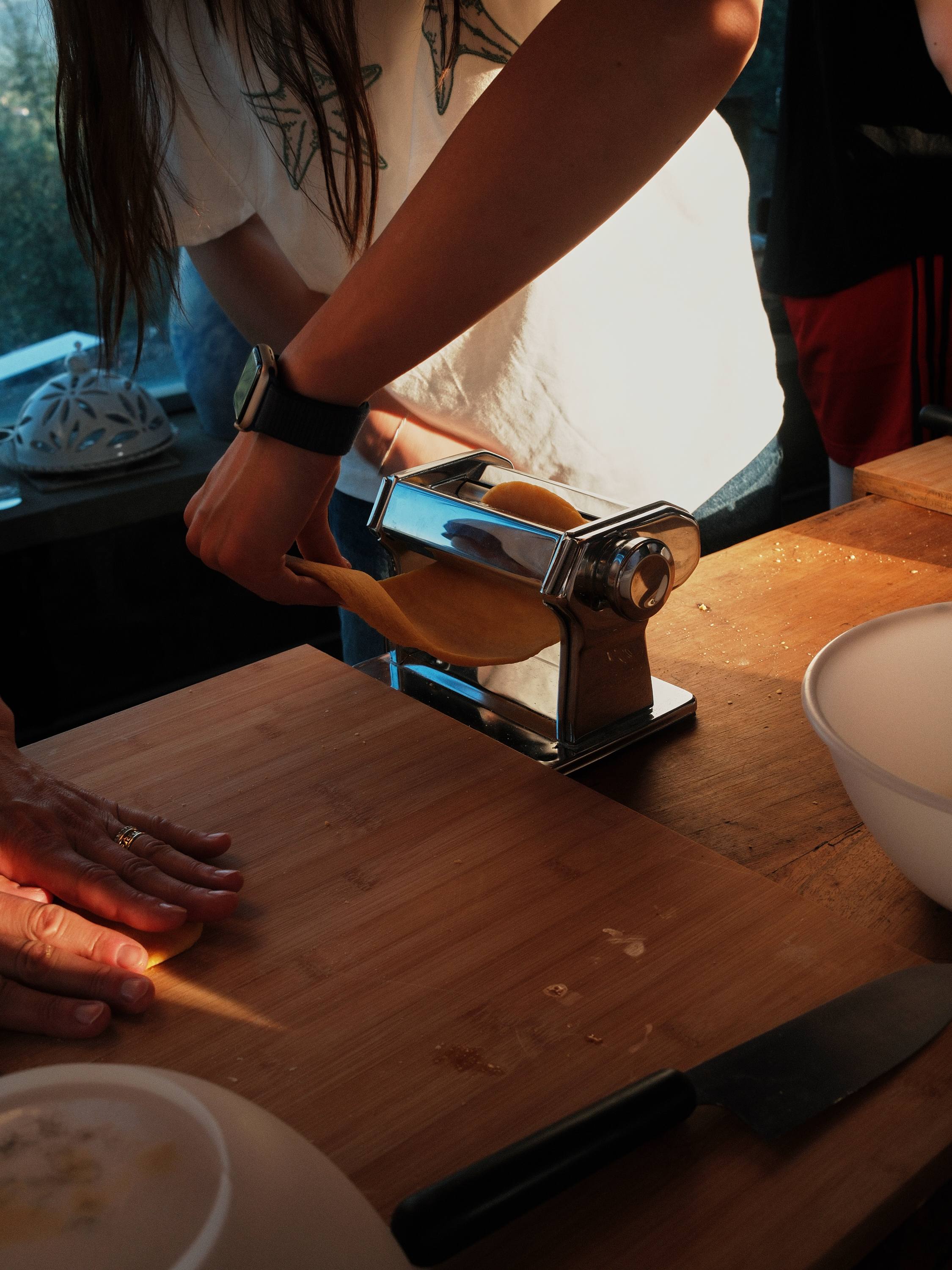Pasta dough through the roller at the cooking class