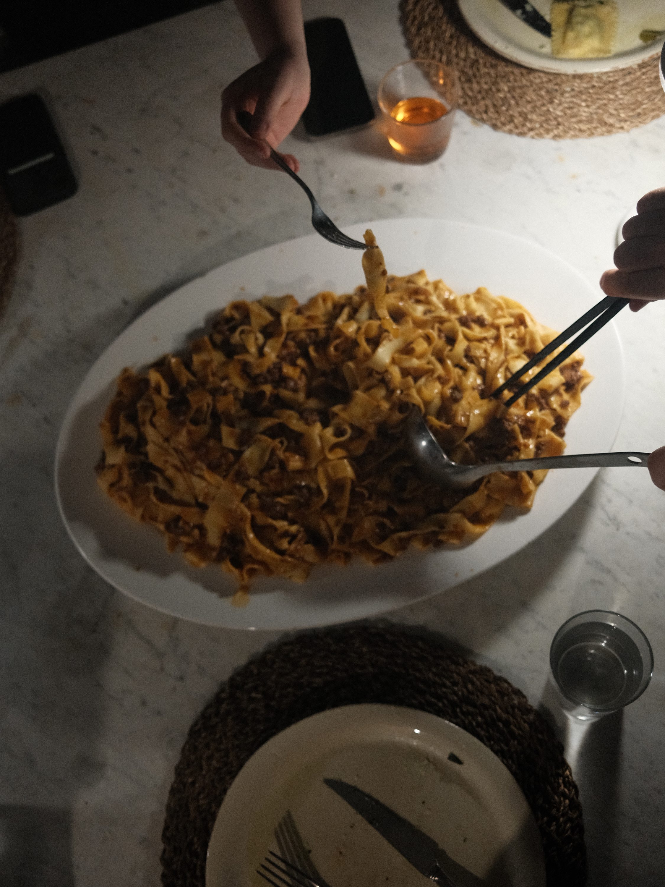 Hand-cut pappardelle served family style
