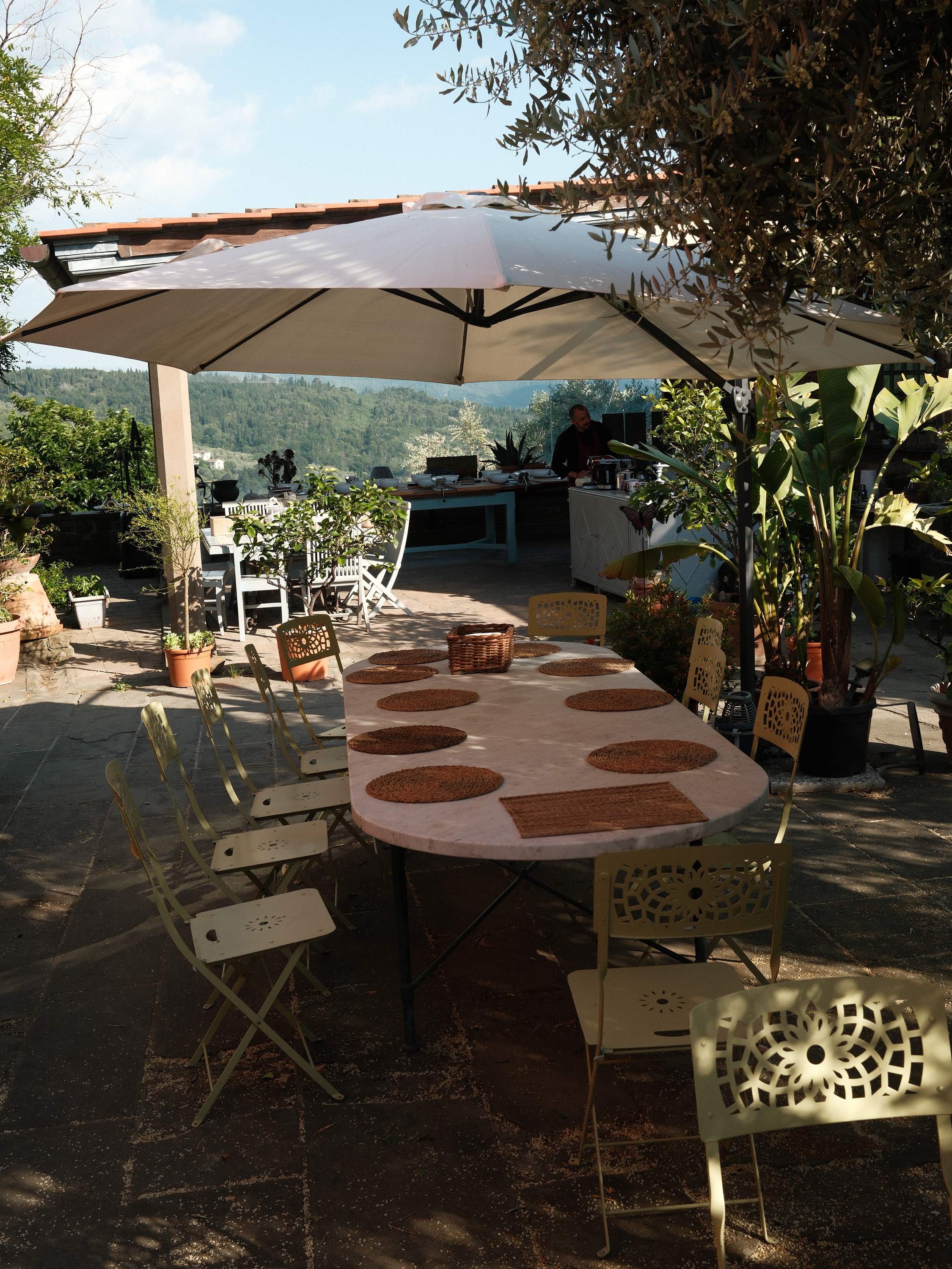 The breakfast table set on the terrace above the valley